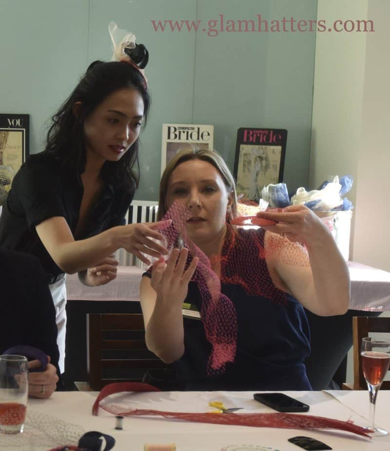 Astri helps out with bird-cage veils at Glam Hatters.