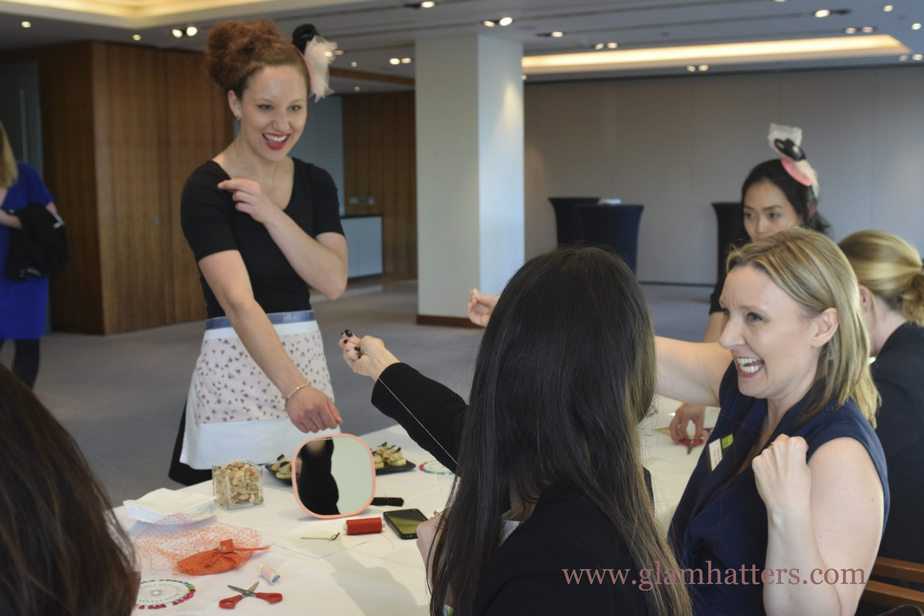 Rachel demonstrates the "how long your thread should be" dance at Glam Hatters!